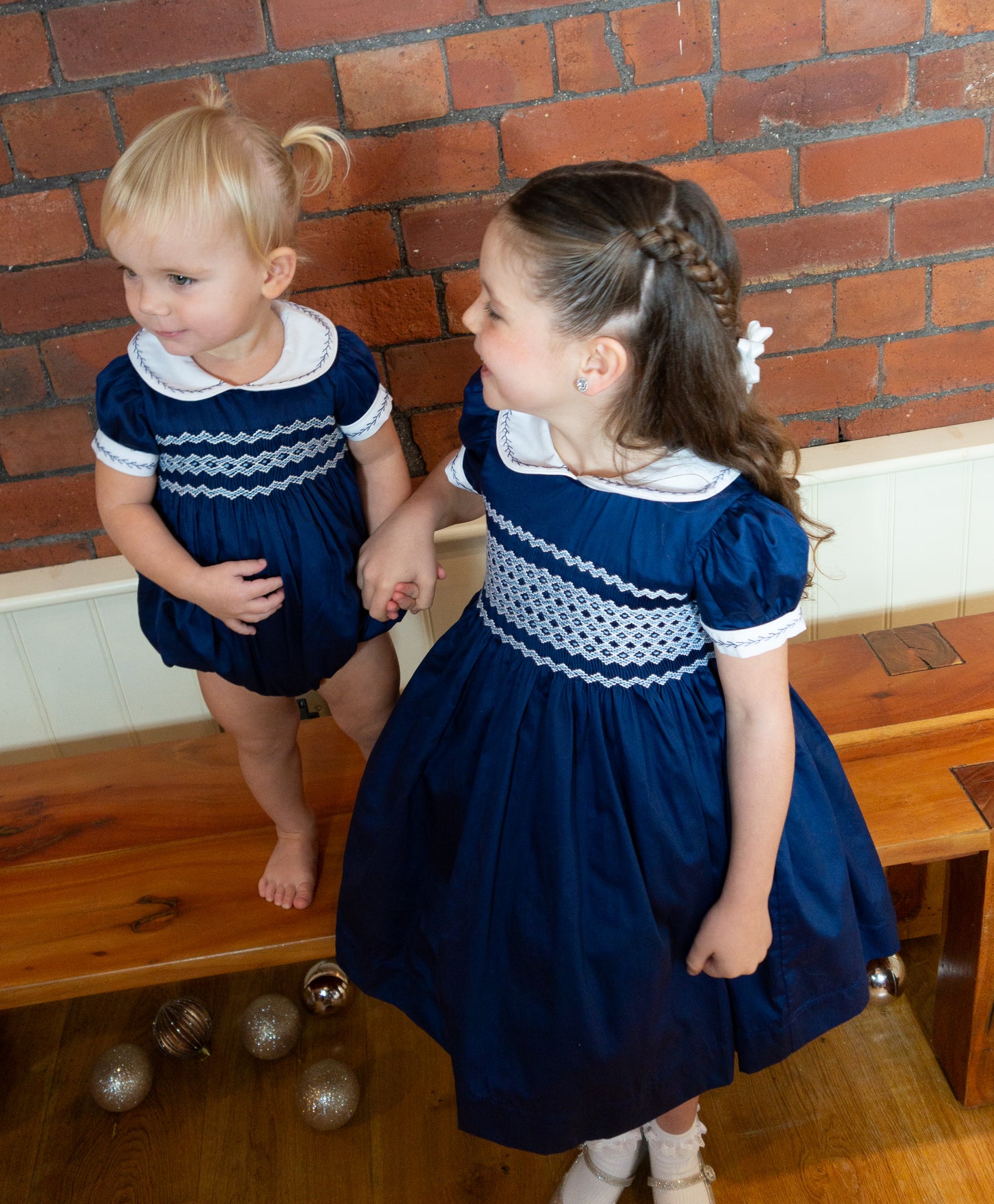 Navy Blue Hand Smocked REGAL Romper